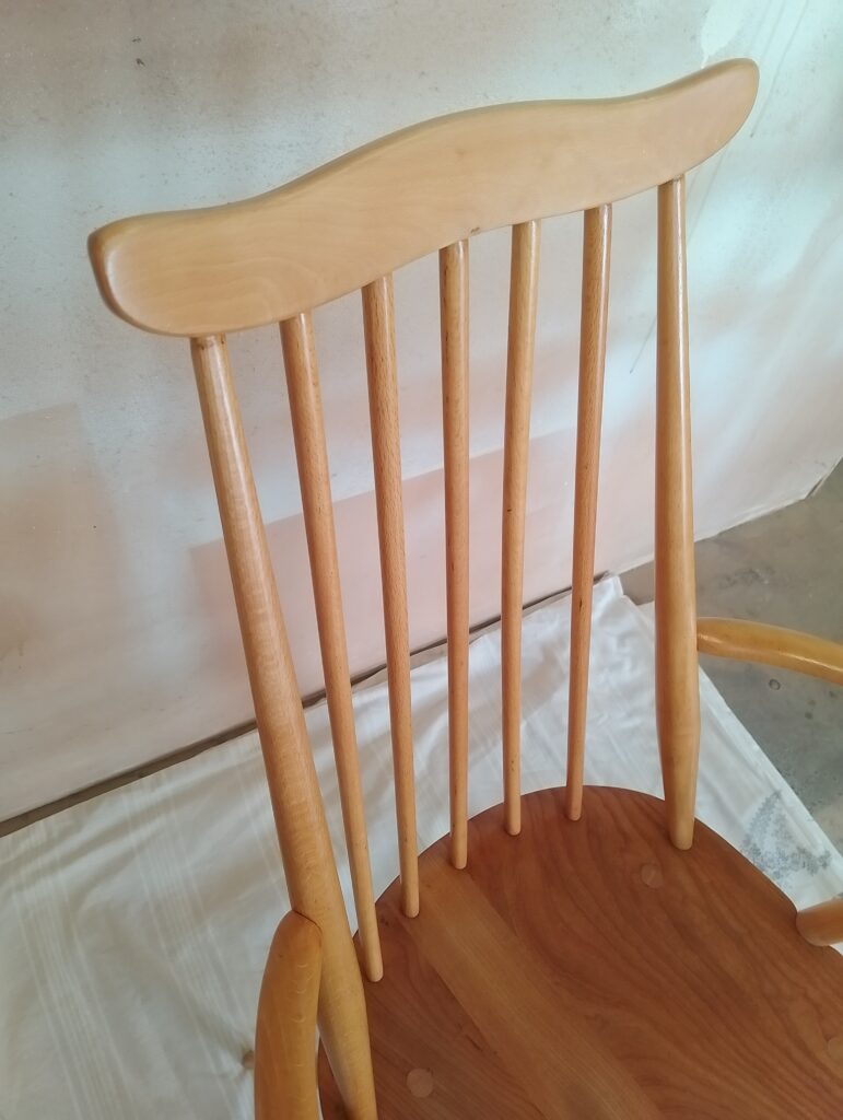 Golden Ercol Goldsmith chair close up on the back rest in beech