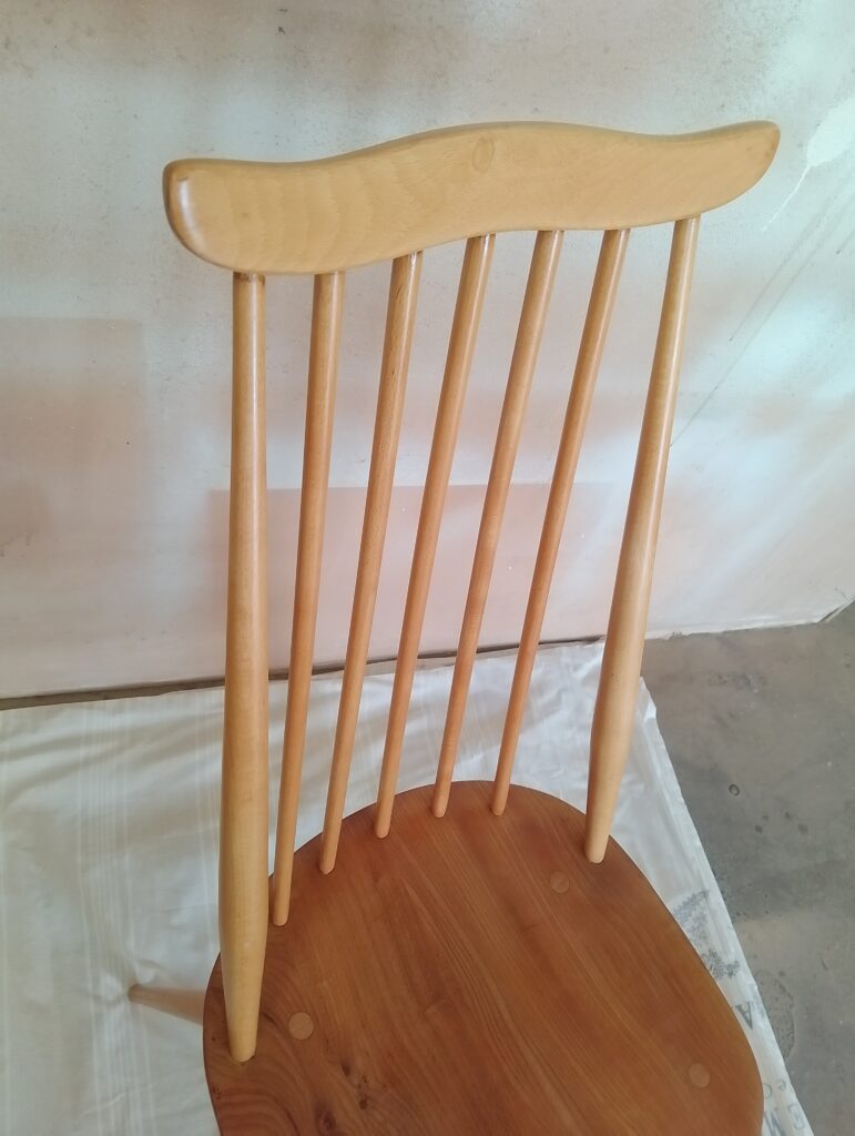 Golden Ercol Goldsmith chair close up on the back rest in beech