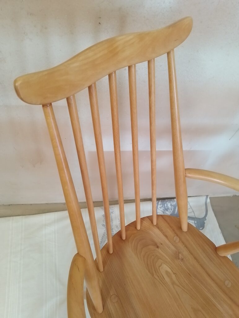 Golden Ercol Goldsmith chair close up on the back rest in beech