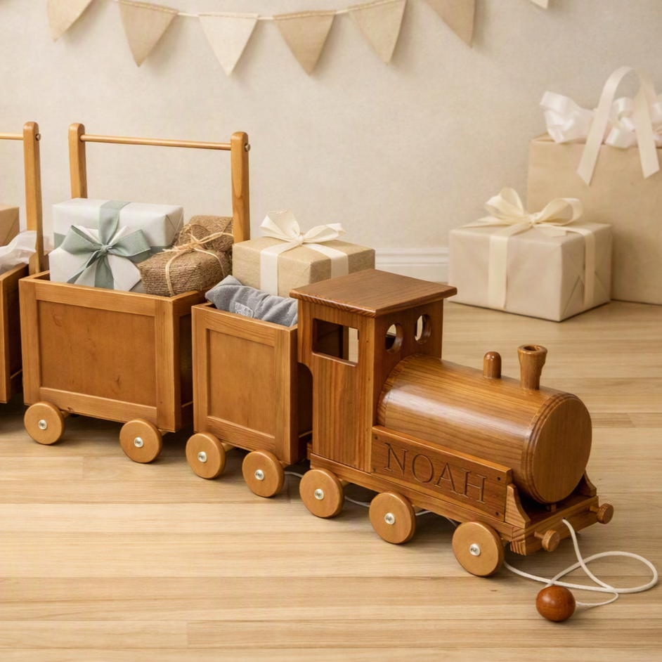 Bespoke wooden toy train with gifts in its carriages for a baby shower